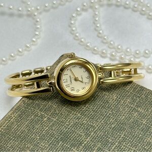 Gold Carriage Cuff Watch